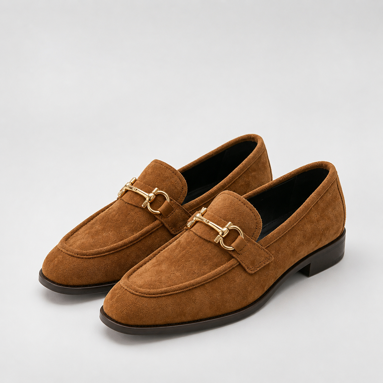 Women's brown horsebit loafers with gold-tone hardware