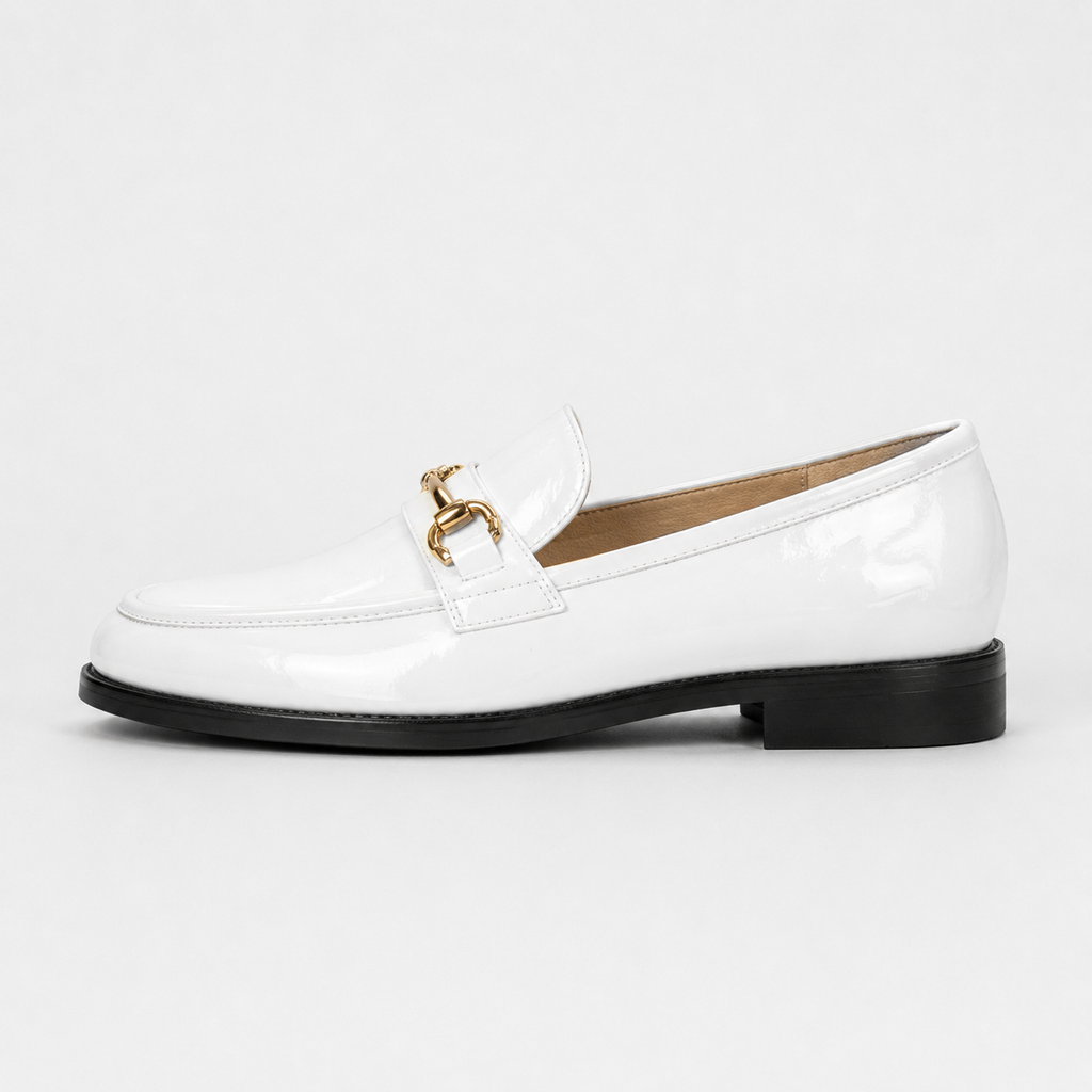 Side view of women's white patent horsebit loafers