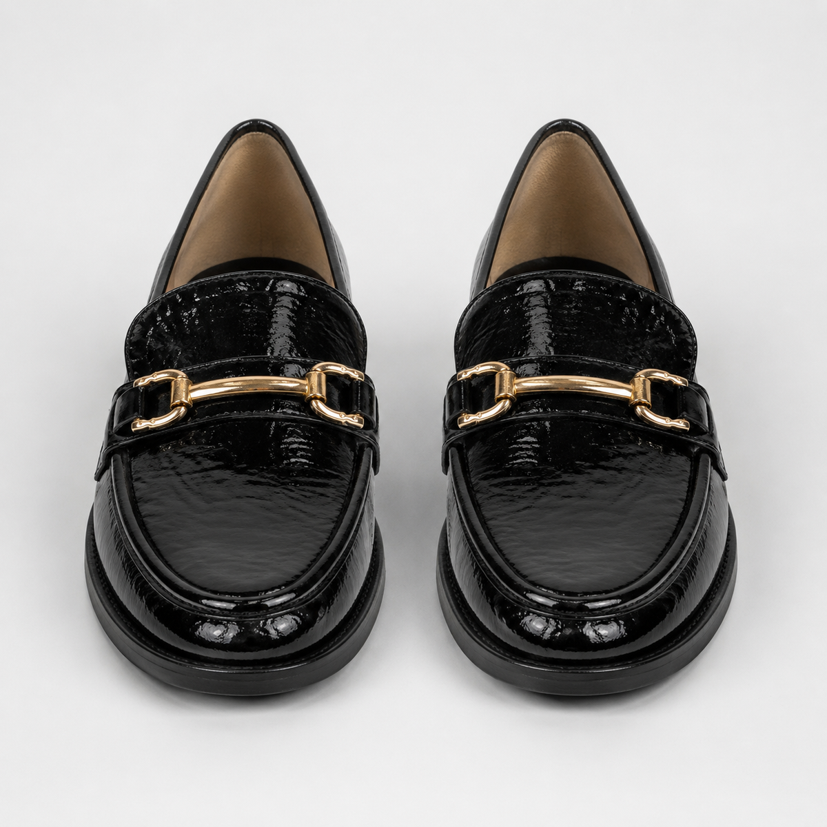 Women's black patent horsebit loafers with gold-tone hardware
