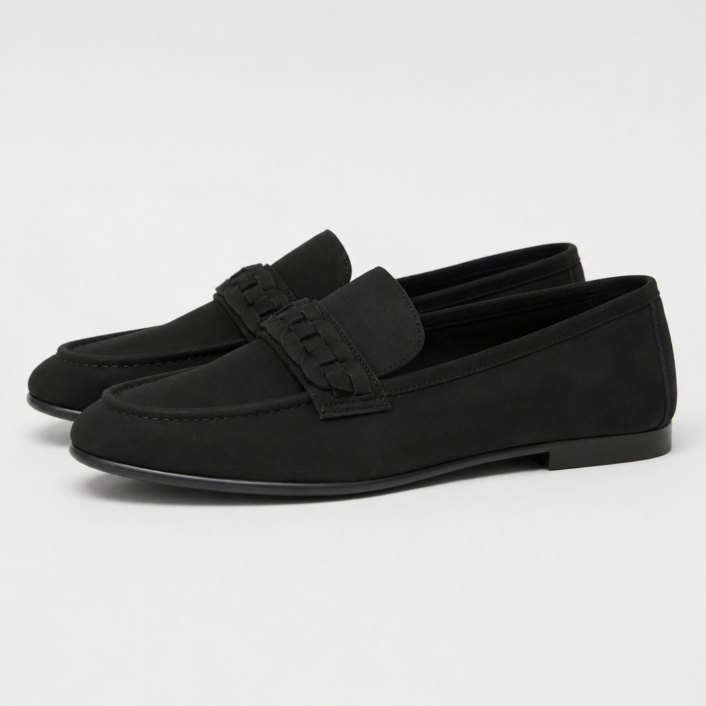 Side view of women's black woven detail loafers