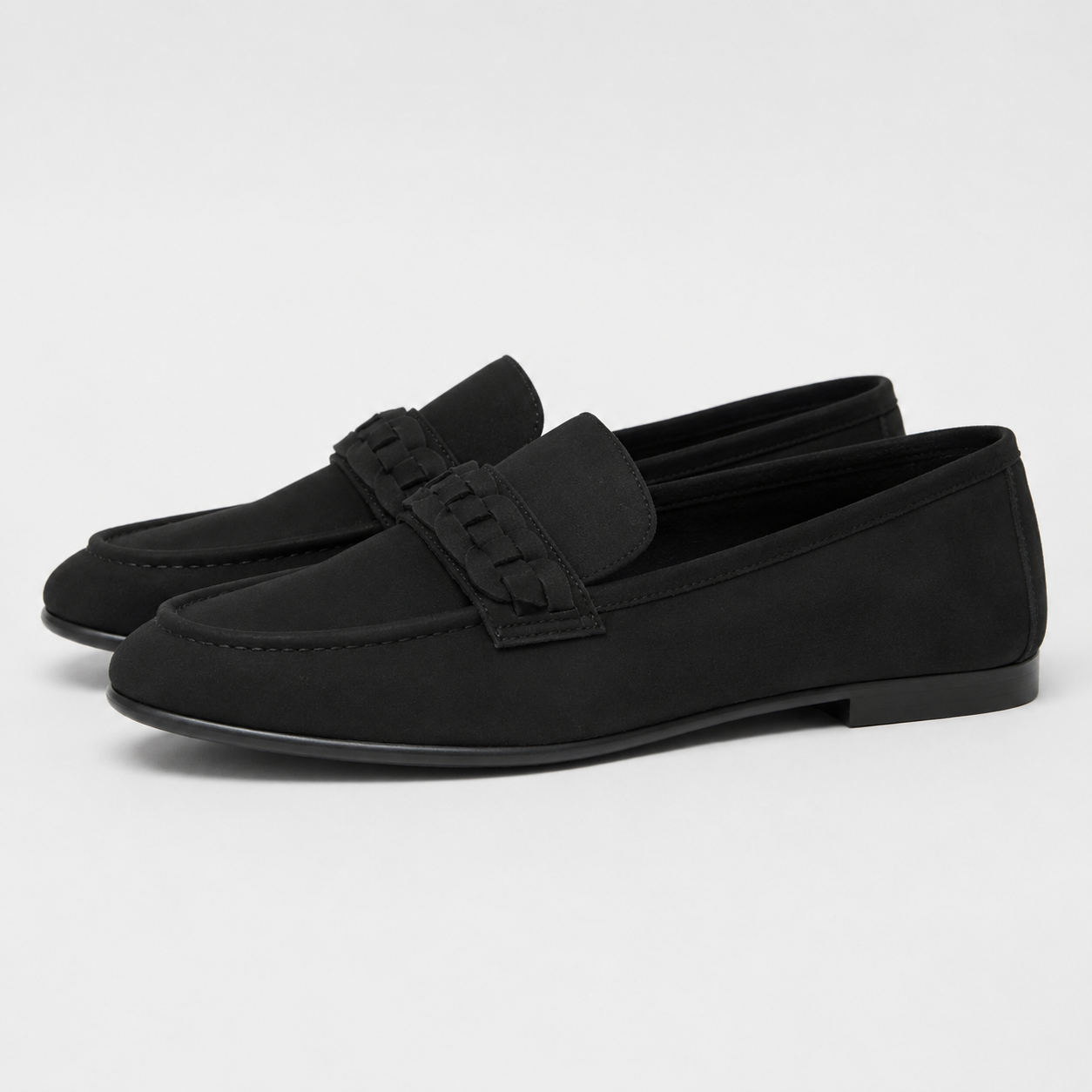 Side view of women's black woven detail loafers
