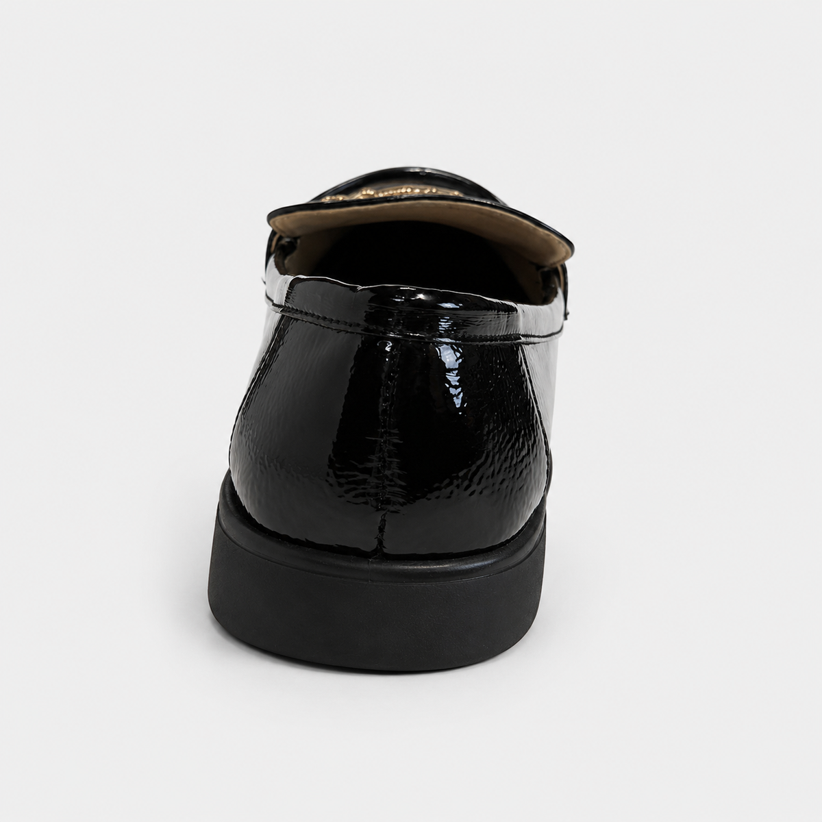 Back view of women's black patent loafers