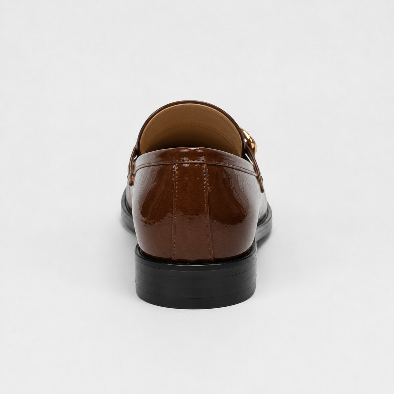 Back view of women's brown patent loafers