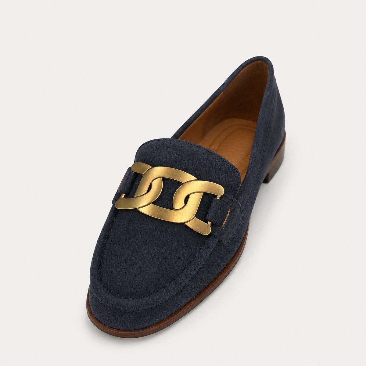 Side view of women's navy chain loafers