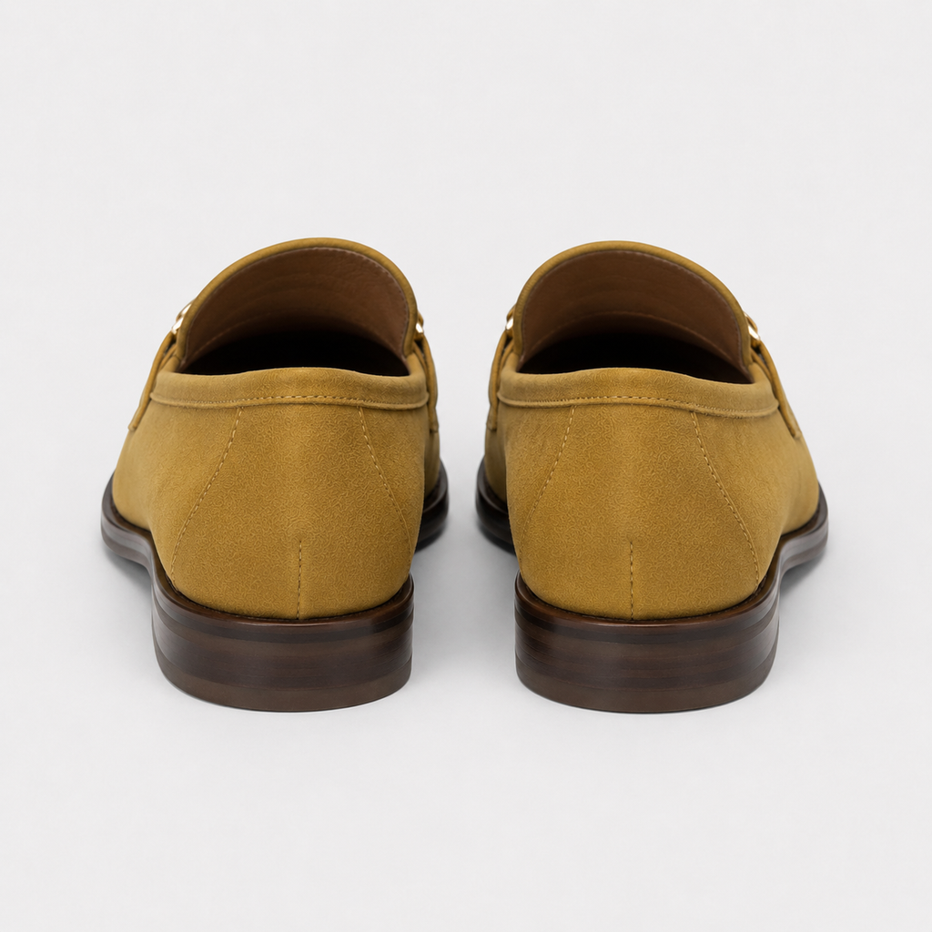 Back view of women's mustard horsebit loafers