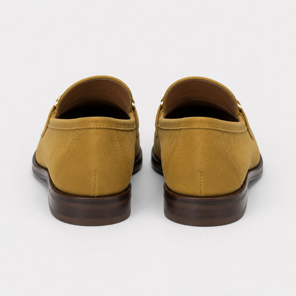 Back view of women's mustard horsebit loafers