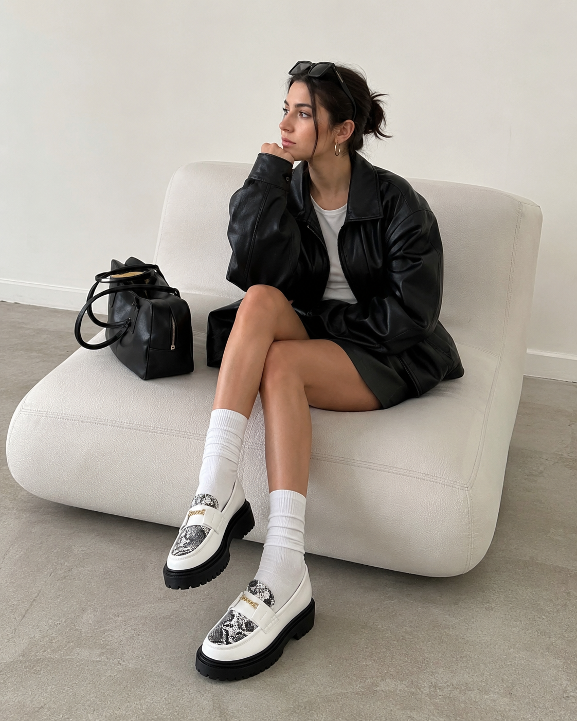 White platform loafers styled with a skirt for a modern everyday outfit