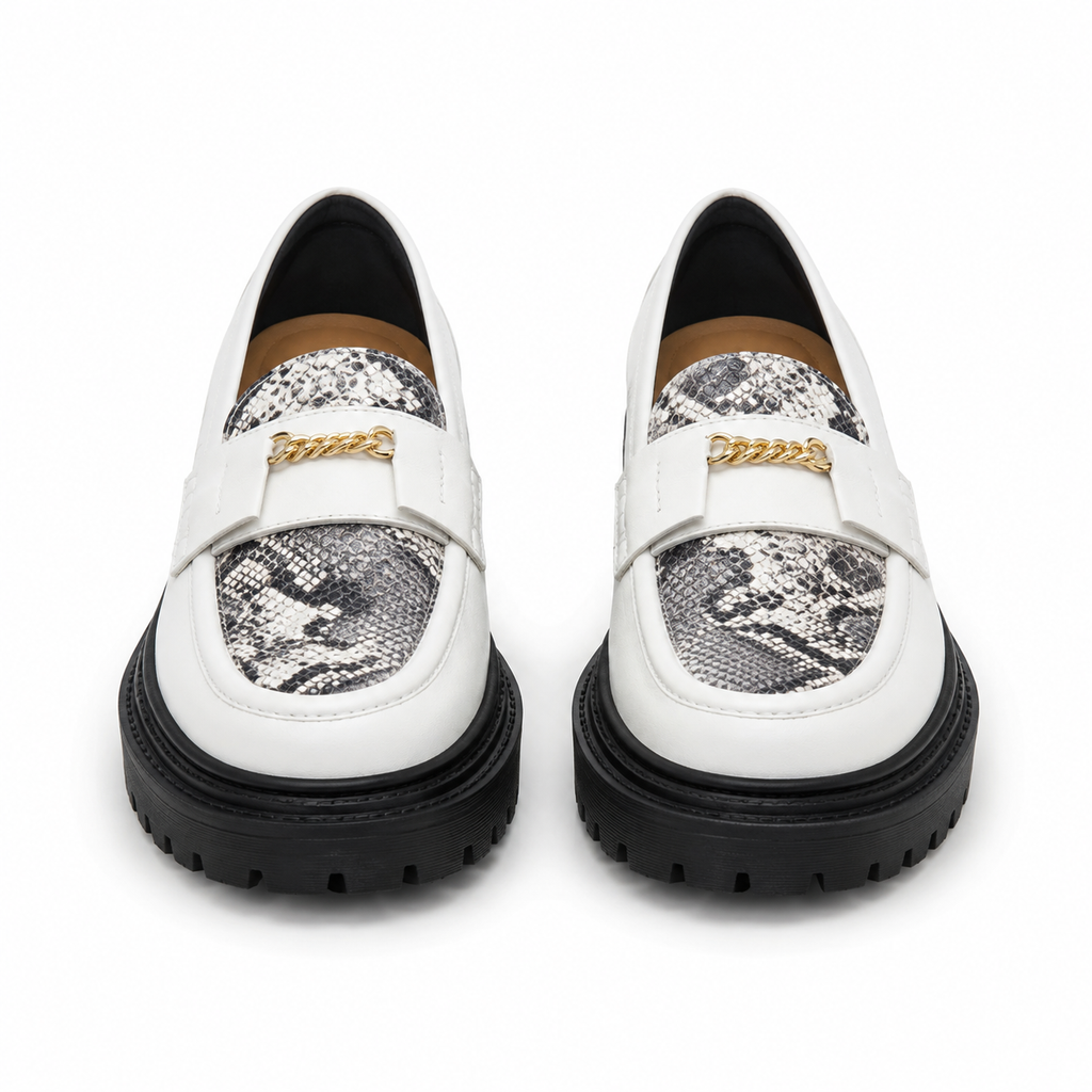 Women's white snakeskin platform loafers with black chunky sole, front view