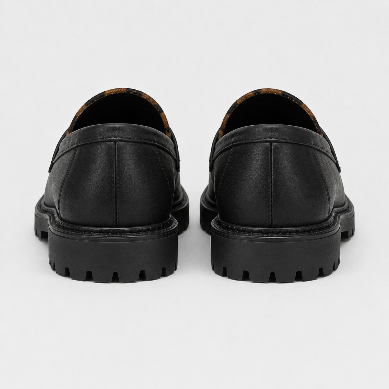 Back view of women's black platform loafers with chunky sole