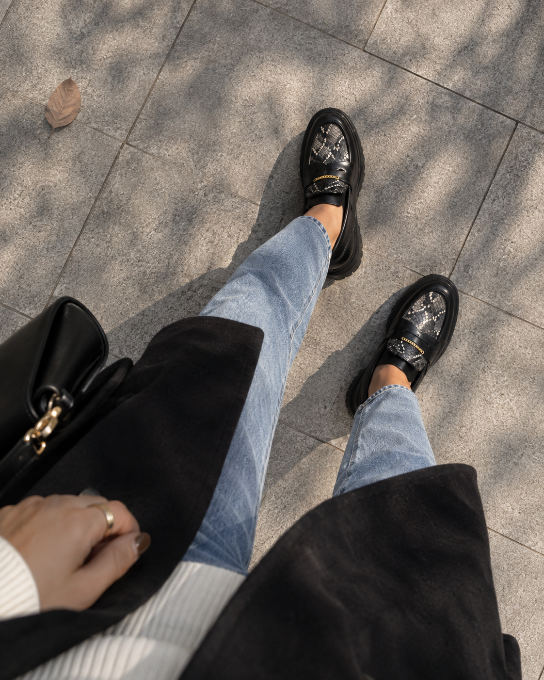 Black platform loafers styled with jeans