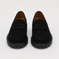 Women's black platform penny loafers with chunky lug sole, front view