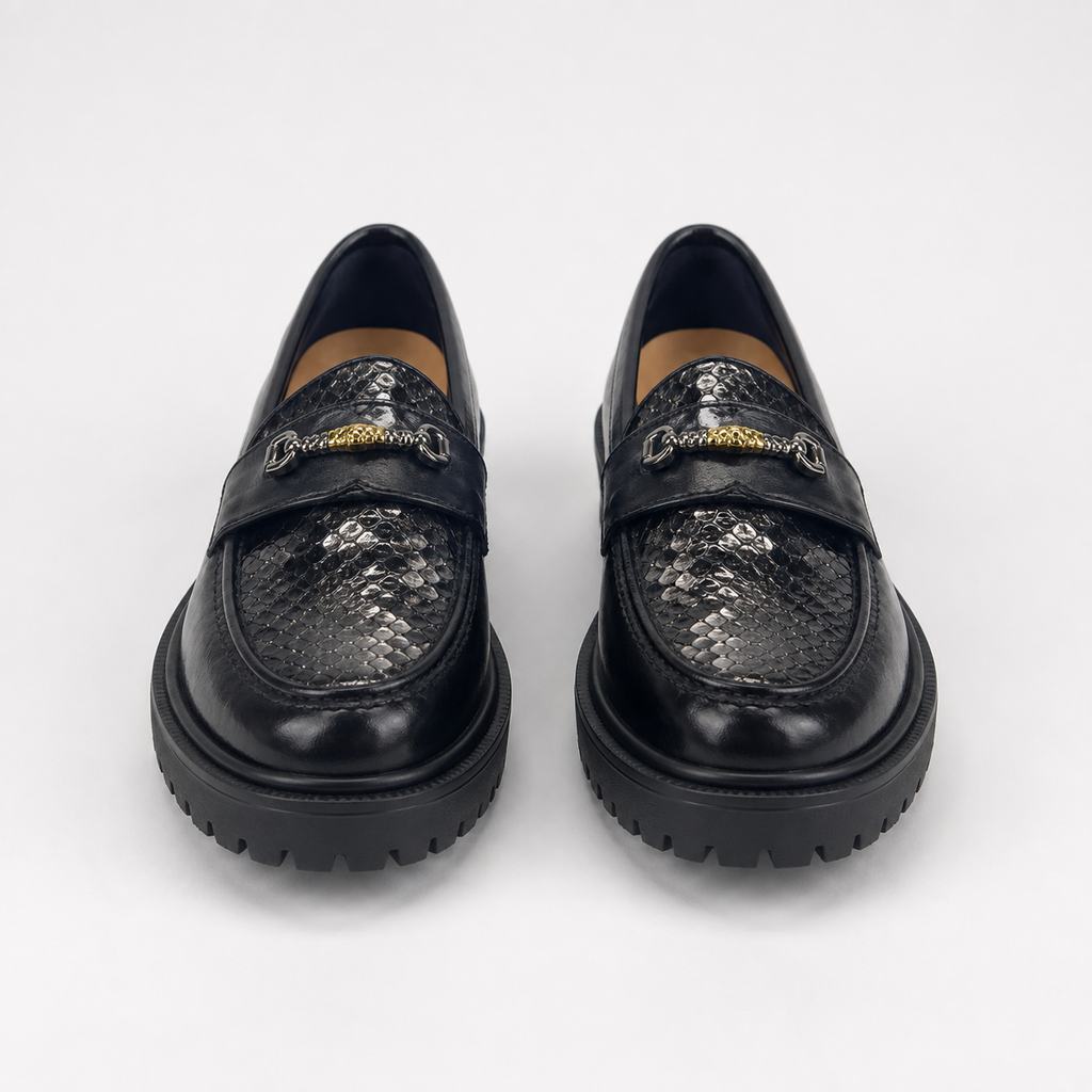 Women's black snakeskin platform loafers, front view