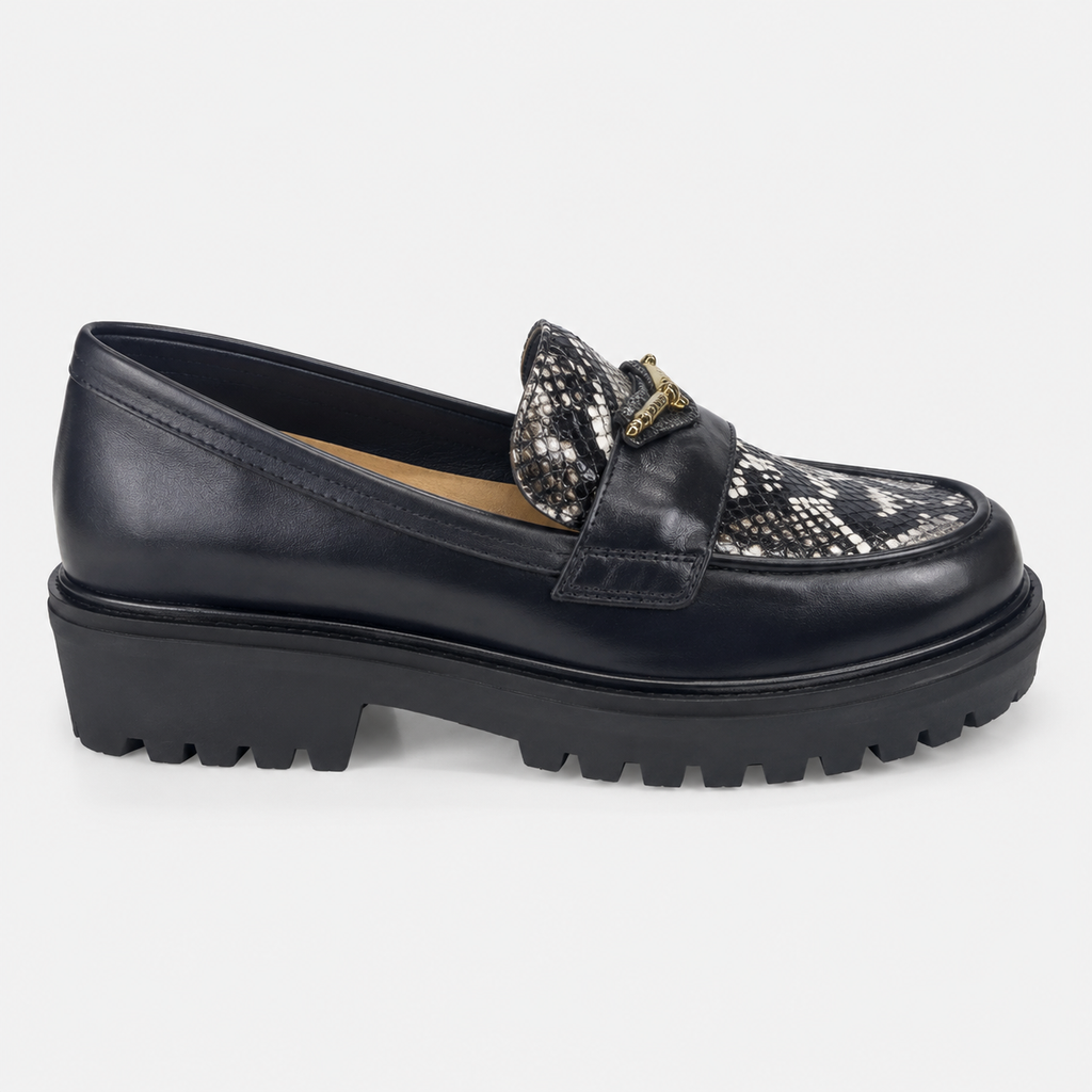 Women's black snakeskin platform loafers with chunky lug sole, side view