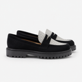Women's black and white platform loafers with chunky lug sole, side view